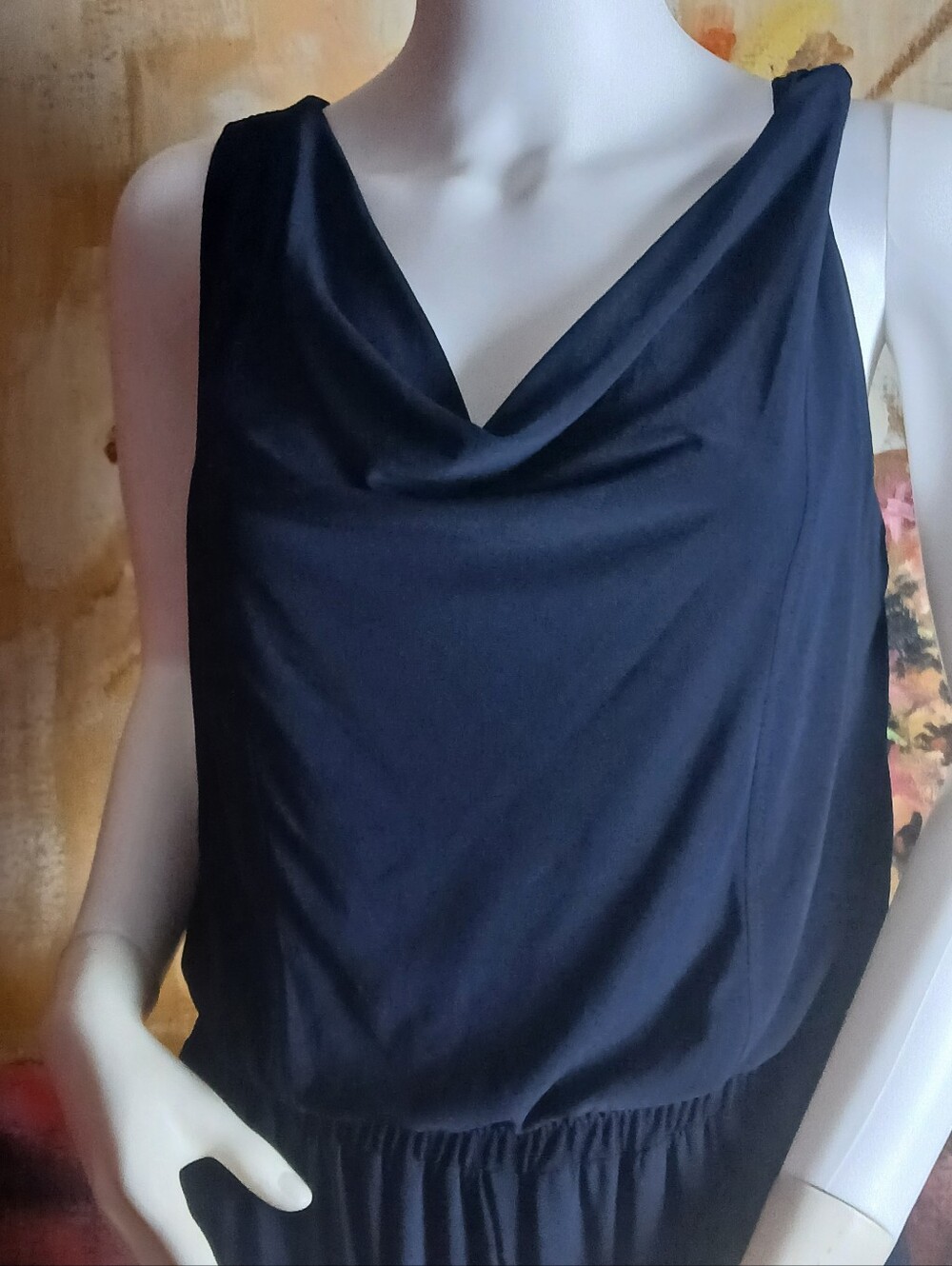 This is a Vince Camuto sleeveless navy blue jersey jumpsuit featuring a draped